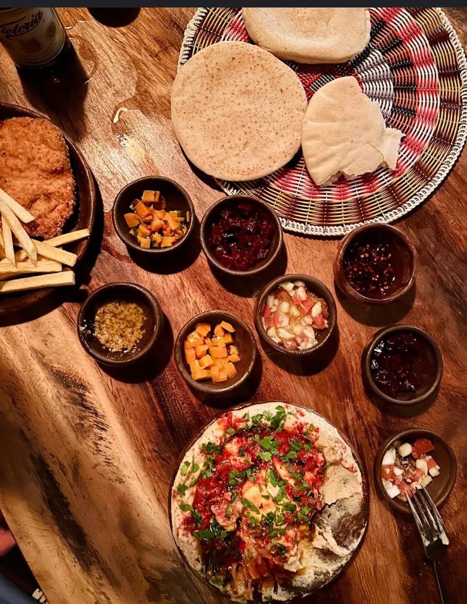Mezze spread with hummus, fries, and pita at Kapara Mio