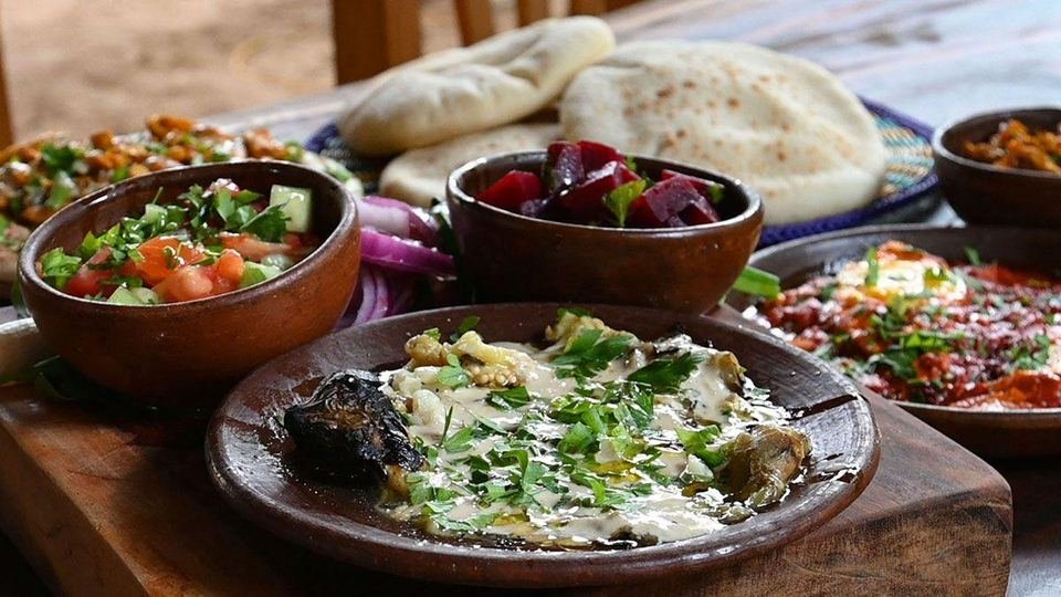 Table spread with baba ganoush and mezze at Kapara Mio